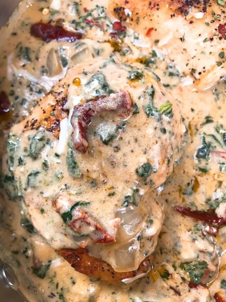 Ready in 30 minutes, this quick and simple skillet chicken recipe is perfect for busy nights. Sundried tomatoes, spinach, and chicken in a creamy Parmesan cheese sauce. Gluten free. Creamy Parmesan Tuscan Chicken #chickenrecipes #quickrecipes #easyrecipes #glutenfreerecipes