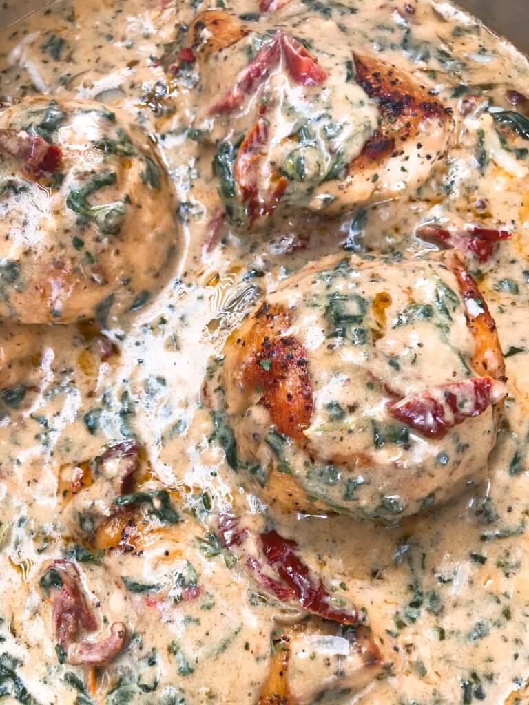 Ready in 30 minutes, this quick and simple skillet chicken recipe is perfect for busy nights. Sundried tomatoes, spinach, and chicken in a creamy Parmesan cheese sauce. Gluten free. Creamy Parmesan Tuscan Chicken #chickenrecipes #quickrecipes #easyrecipes #glutenfreerecipes