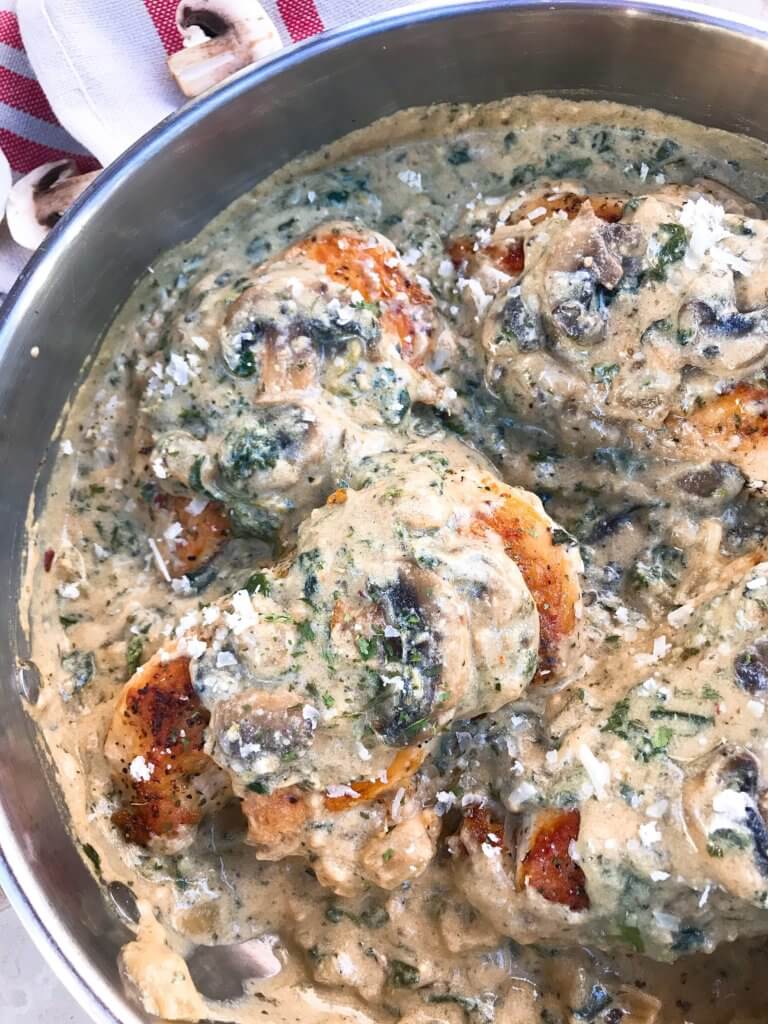 Ready in just 30 minutes, this Skillet Chicken Florentine one pot dinner is quick and simple to make. Chicken is browned and cooked in a creamy Parmesan sauce with spinach and mushrooms. Gluten free. #chickendinner #chickenrecipes #onepotrecipes #onepotdinner #glutenfreerecipes