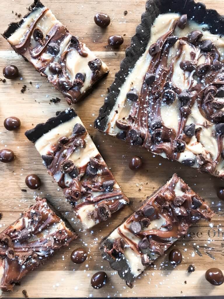 A quick and easy indulgent dessert, this Chocolate Espresso Tart is ready in just 30 minutes. A soft cocoa cookie shell is filled with a coffee cream cheese, Nutella chocolate hazelnut spread, chocolate espresso beans, and chocolate chips. #chocolateespresso #chocolatedesserts #fastdesserts #tartrecipes #chocolaterecipes