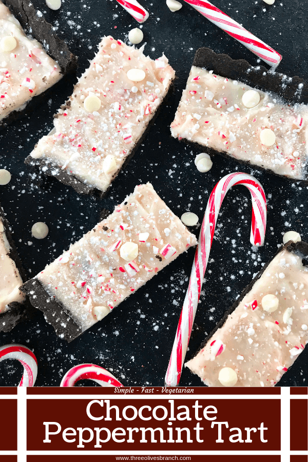 A simple Christmas baking recipe ready in 30 minutes. Chocolate Peppermint Tart is a soft cocoa shell filled with a peppermint cream cheese filling and topped with crushed candy canes and white chocolate. Fast and easy vegetarian holiday recipe. #chocolatepeppermint #christmasdessert #peppermintrecipes