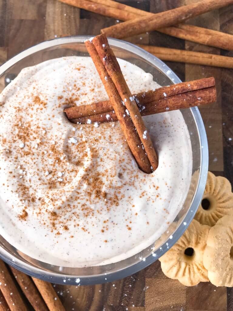 Ready in 5 minutes, this fast and easy holiday dessert is perfect for dunking Christmas cookies. Eggnog Cream Cheese Dip is made with cream cheese, sugar, eggnog, cinnamon, and nutmeg for a simple Christmas dessert. Vegetarian and gluten free. #christmasdessert #eggnog #christmasrecipe