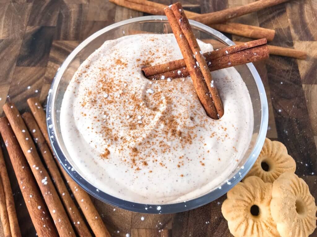 Ready in 5 minutes, this fast and easy holiday dessert is perfect for dunking Christmas cookies. Eggnog Cream Cheese Dip is made with cream cheese, sugar, eggnog, cinnamon, and nutmeg for a simple Christmas dessert. Vegetarian and gluten free. #christmasdessert #eggnog #christmasrecipe