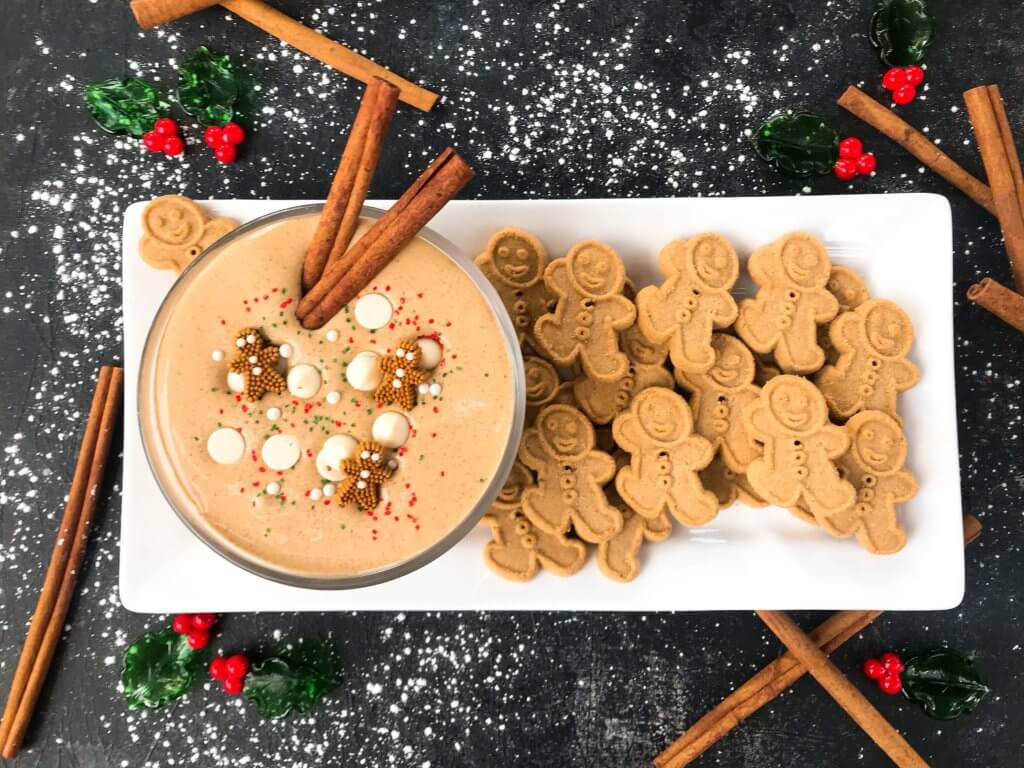 This fast and easy holiday Christmas dessert recipe is ready in 5 minutes. Gingerbread Cream Cheese Dip is gluten free, vegetarian, and flavored with cinnamon, molasses, nutmeg, and ginger. Dunk gingerbread cookies, apples, and pears. #christmasrecipe #holidaydessert #christmasdessert