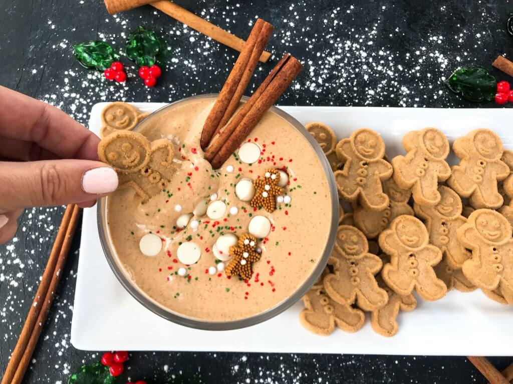 This fast and easy holiday Christmas dessert recipe is ready in 5 minutes. Gingerbread Cream Cheese Dip is gluten free, vegetarian, and flavored with cinnamon, molasses, nutmeg, and ginger. Dunk gingerbread cookies, apples, and pears. #christmasrecipe #holidaydessert #christmasdessert