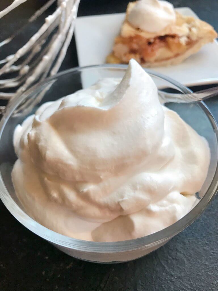 A fast and simple 5 minute whipped cream. Learn How To Make Whipped Cream with just three ingredients for your holiday desserts. #holidaydesserts #easydesserts #whippedcream #whipcream