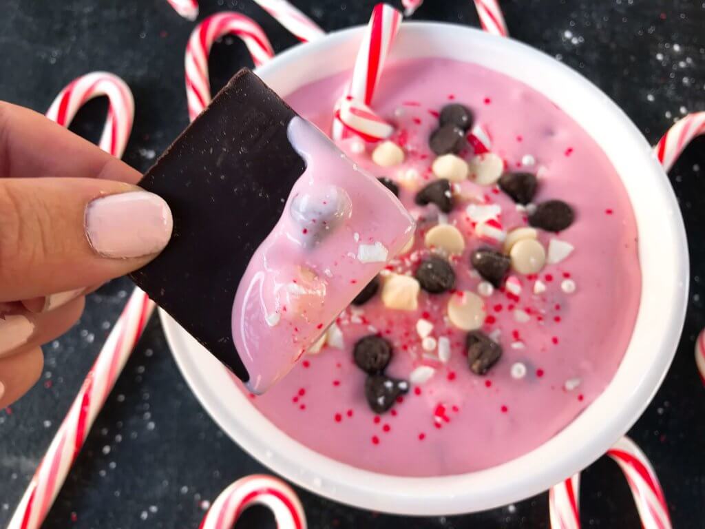 This fast and easy holiday dessert recipe only takes 5 minutes. Peppermint Bark Cream Cheese Dip is a great Christmas dessert made of cream cheese, crushed candy canes, milk and white chocolate, and peppermint. Vegetarian and gluten free. #christmasdessert #christmasrecipe #peppermint