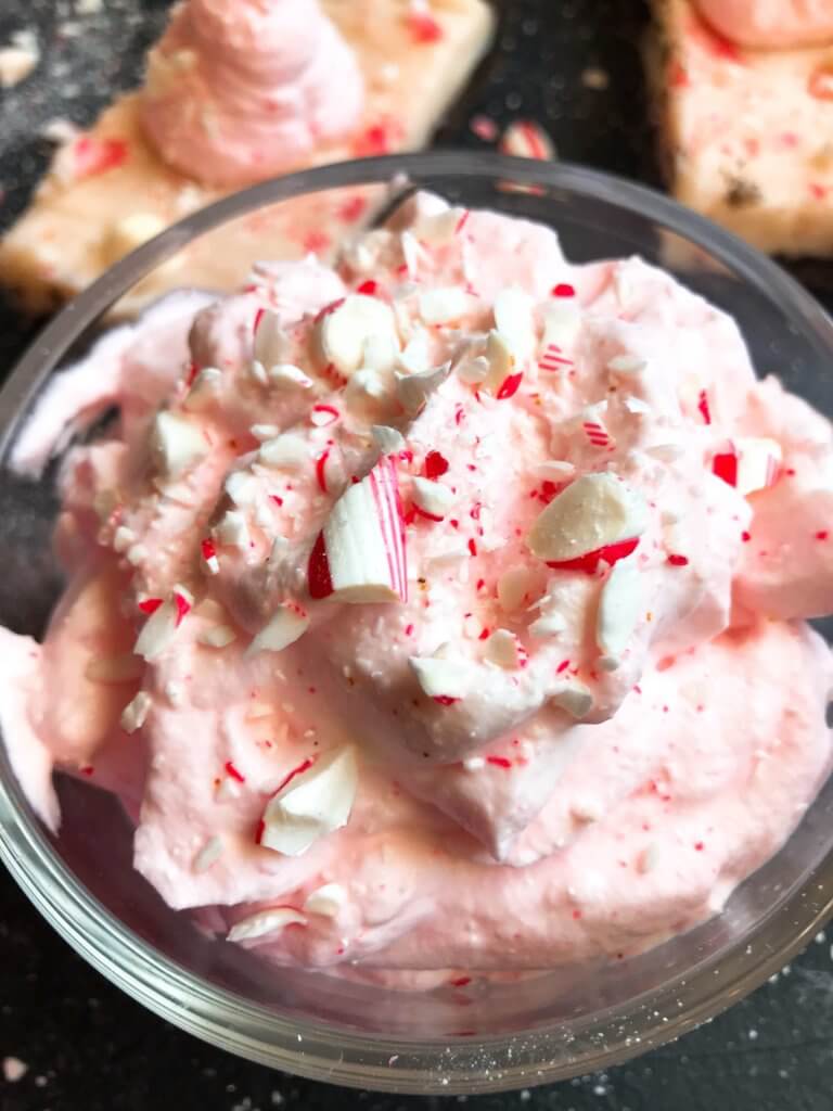 A fast and simple 5 minute whipped cream. Peppermint Whipped Cream is made with just three ingredients for your holiday desserts. #holidaydesserts #easydesserts #whippedcream #whipcream #peppermint