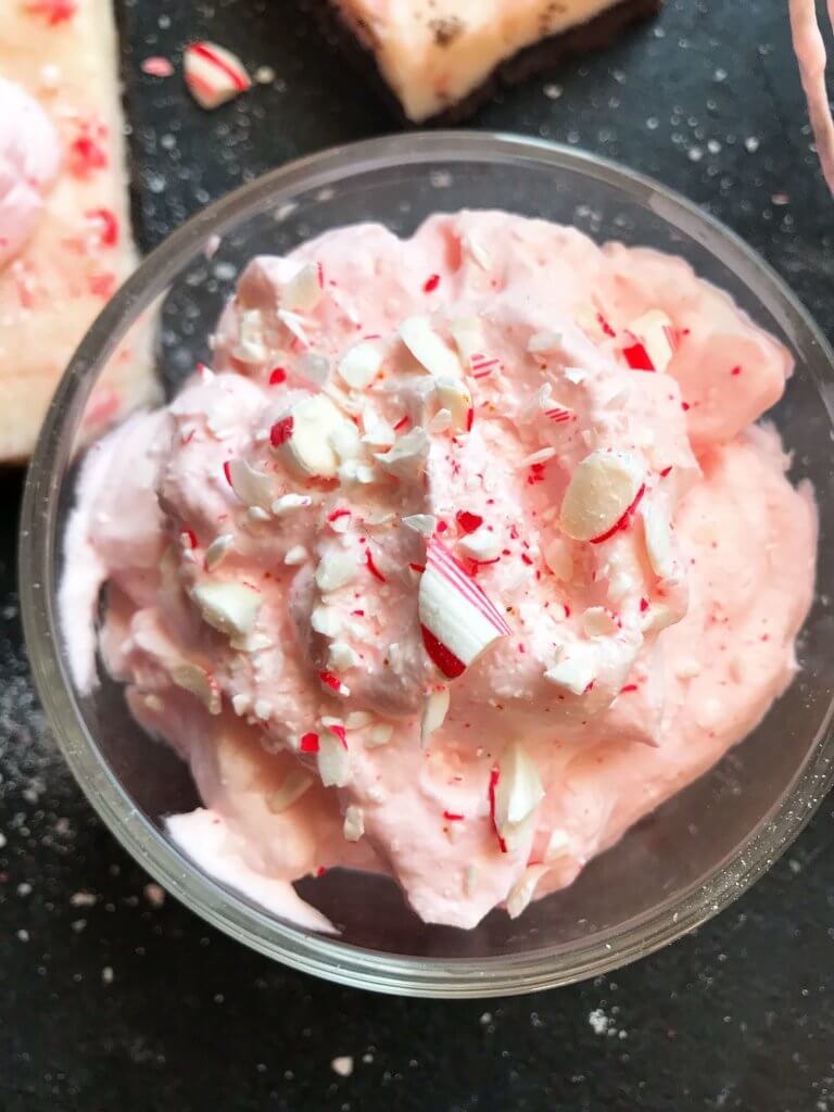 A fast and simple 5 minute whipped cream. Peppermint Whipped Cream is made with just three ingredients for your holiday desserts. #holidaydesserts #easydesserts #whippedcream #whipcream #peppermint