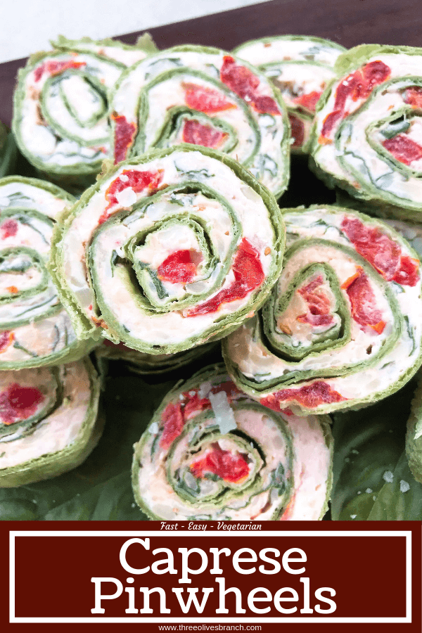 Fast and simple appetizer recipe. Caprese Pinwheel Roll Ups are filled with cream cheese, tomatoes, fresh basil, mozzarella, and Parmesan rolled up in tortillas and sliced into party finger food bites. Vegetarian. #caprese #appetizerrecipes #vegetarianrecipes