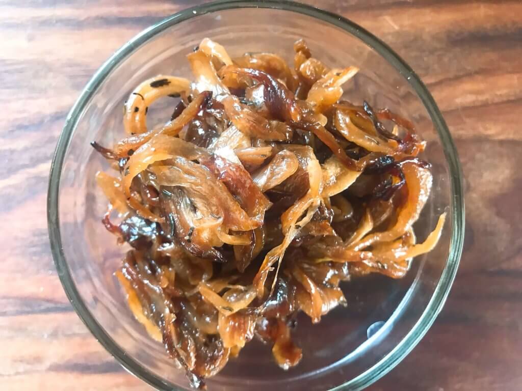 Learn How to Caramelize Onions. A simple recipe ready in 30 minutes, the onions are gluten free, vegan, vegetarian, paleo, and Whole 30. A perfect condiment to top on just about anything!