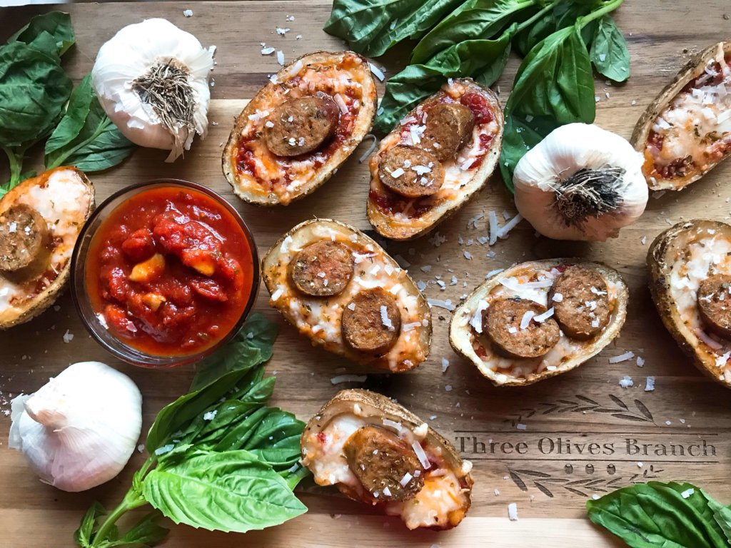 A simple and easy game day appetizer recipe. Italian Sausage Marinara Potato Skins are stuffed with marinara sauce, mozzarella, Parmesan cheese, and Italian sausage links. Delicious comfort food for parties and entertaining. Gluten free. #superbowlrecipes #gamedayrecipes #sausagerecipes #appetizers #glutenfreerecipes