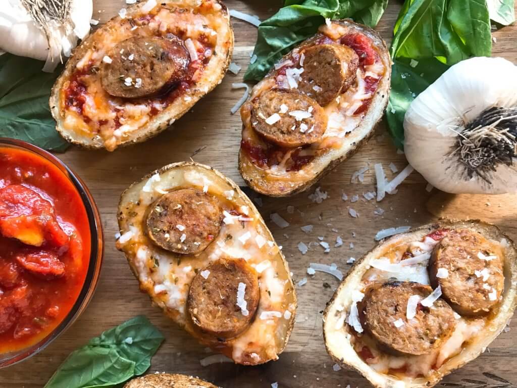 A simple and easy game day appetizer recipe. Italian Sausage Marinara Potato Skins are stuffed with marinara sauce, mozzarella, Parmesan cheese, and Italian sausage links. Delicious comfort food for parties and entertaining. Gluten free. #superbowlrecipes #gamedayrecipes #sausagerecipes #appetizers #glutenfreerecipes