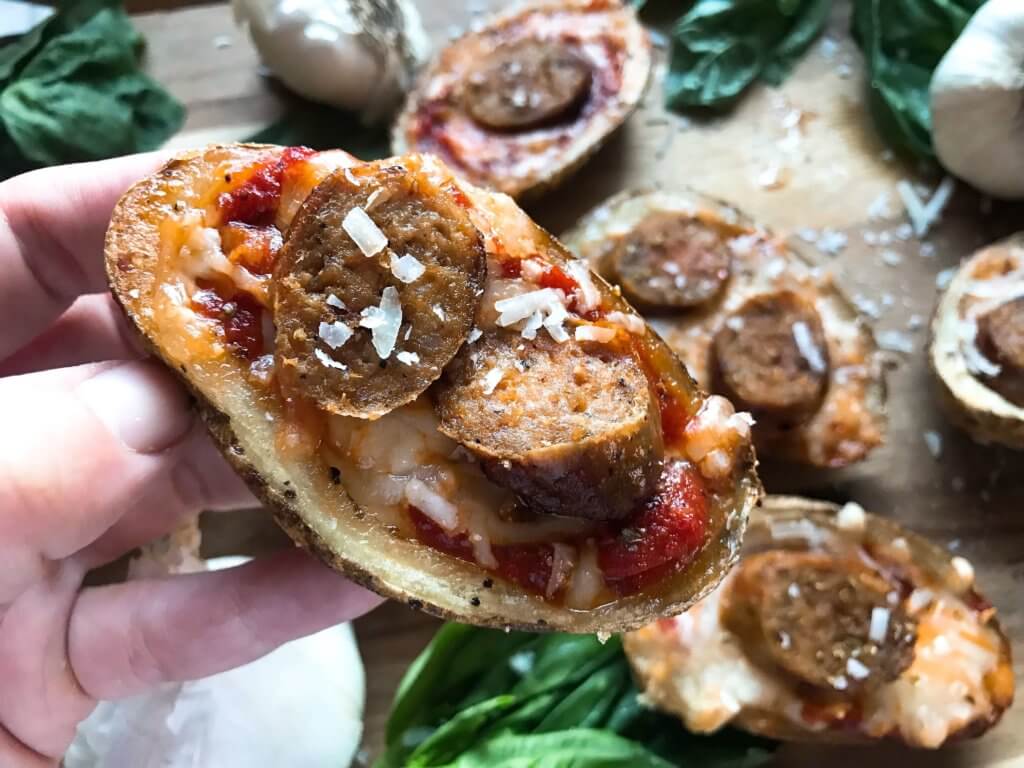 A simple and easy game day appetizer recipe. Italian Sausage Marinara Potato Skins are stuffed with marinara sauce, mozzarella, Parmesan cheese, and Italian sausage links. Delicious comfort food for parties and entertaining. Gluten free. #superbowlrecipes #gamedayrecipes #sausagerecipes #appetizers #glutenfreerecipes