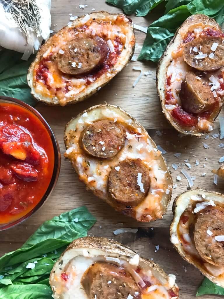 A simple and easy game day appetizer recipe. Italian Sausage Marinara Potato Skins are stuffed with marinara sauce, mozzarella, Parmesan cheese, and Italian sausage links. Delicious comfort food for parties and entertaining. Gluten free. #superbowlrecipes #gamedayrecipes #sausagerecipes #appetizers #glutenfreerecipes