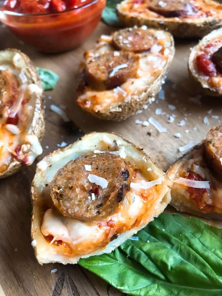 A simple and easy game day appetizer recipe. Italian Sausage Marinara Potato Skins are stuffed with marinara sauce, mozzarella, Parmesan cheese, and Italian sausage links. Delicious comfort food for parties and entertaining. Gluten free. #superbowlrecipes #gamedayrecipes #sausagerecipes #appetizers #glutenfreerecipes