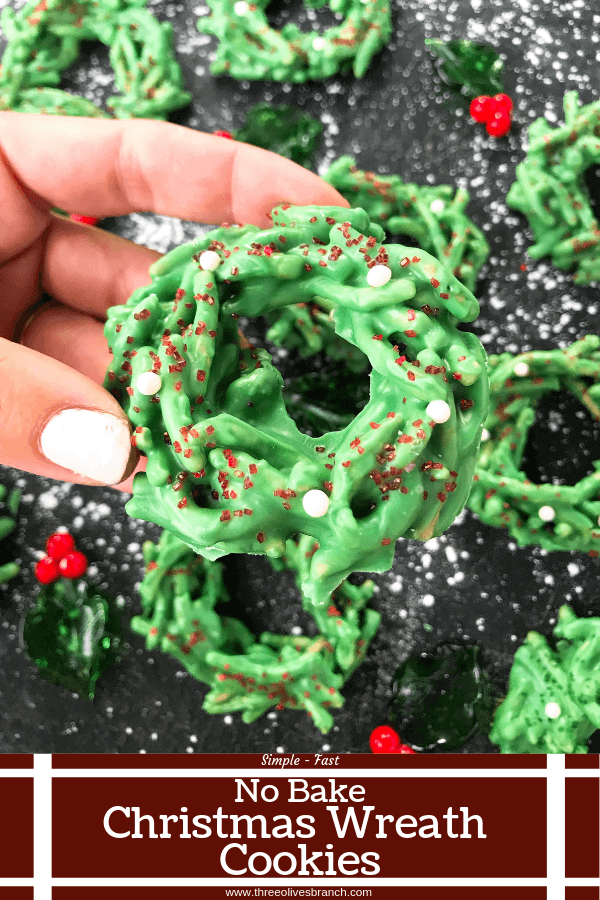 Pin image of a hand holding a No Bake Christmas Wreath Cookies with title at bottom