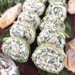 Pin image for Spinach Artichoke Dip Pinwheels in two rows with title at bottom