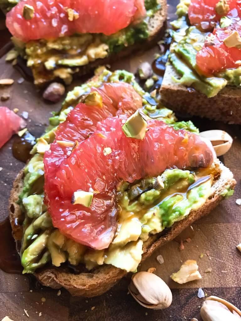 A quick and simple vegan breakfast or brunch recipe ready in just a few minutes. Balsamic Grapefruit Avocado Toast sprinkled with chopped pistachios. #avocadotoast #breakfastrecipes #veganbreakfast