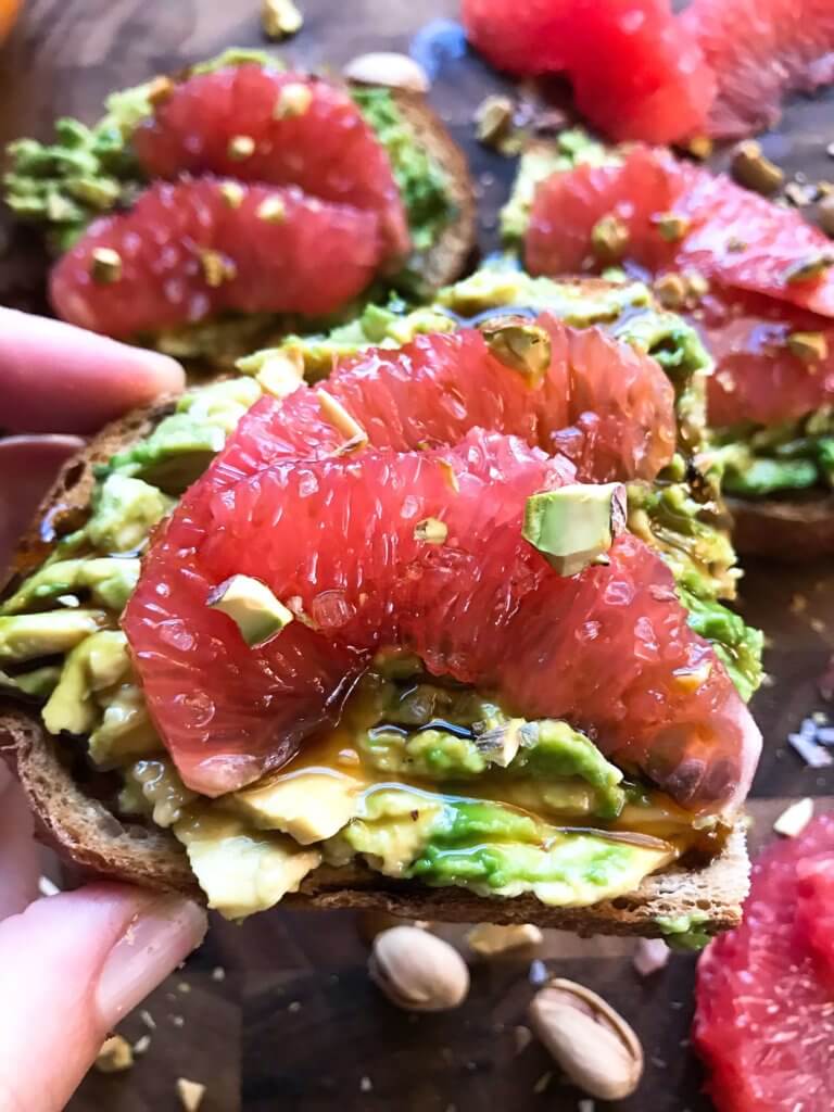 A quick and simple vegan breakfast or brunch recipe ready in just a few minutes. Balsamic Grapefruit Avocado Toast sprinkled with chopped pistachios. #avocadotoast #breakfastrecipes #veganbreakfast