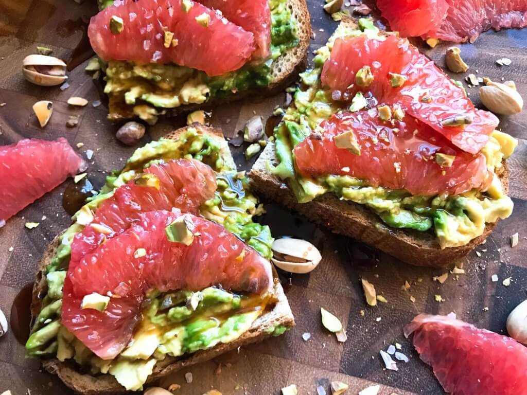 A quick and simple vegan breakfast or brunch recipe ready in just a few minutes. Balsamic Grapefruit Avocado Toast sprinkled with chopped pistachios. #avocadotoast #breakfastrecipes #veganbreakfast