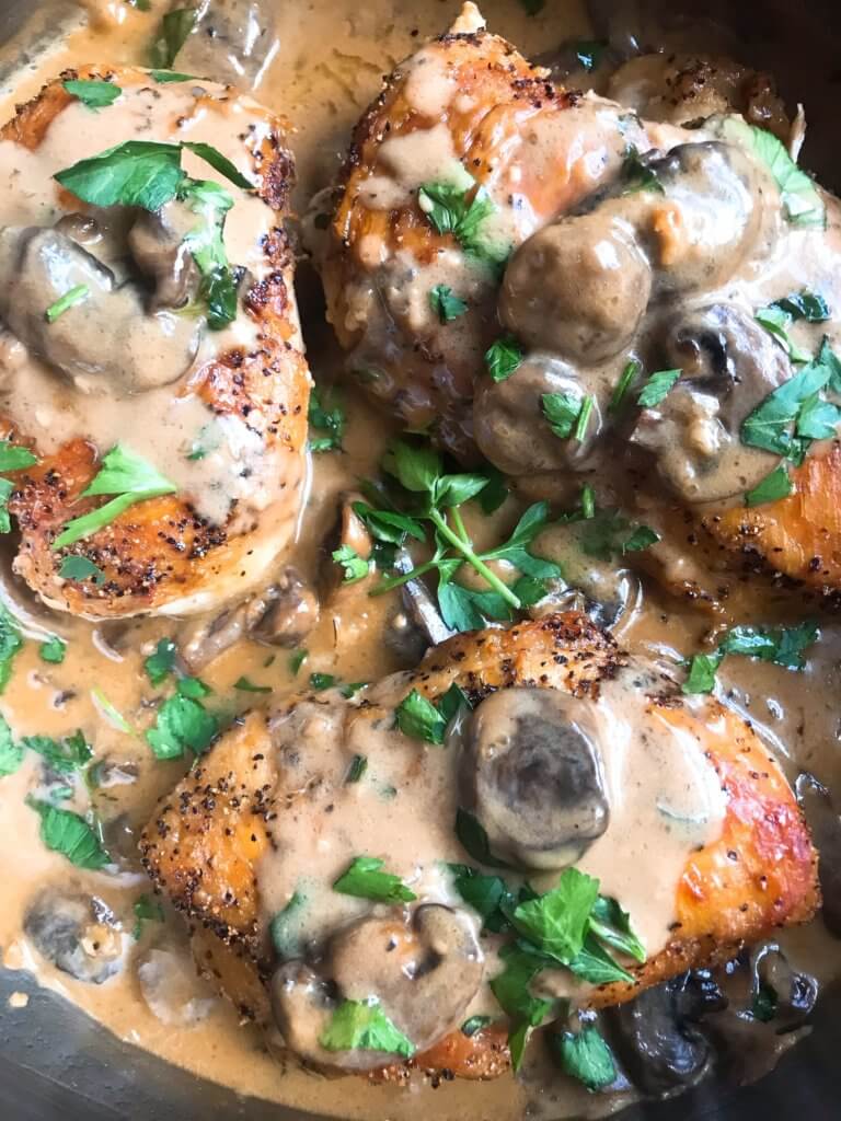 Skillet Chicken Marsala is a one pot meal ready in just 30 minutes. A quick and simple dinner recipe great with potatoes, pasta, rice, and vegetables. Chicken breasts cooked with Marsala wine sauce and mushrooms. Gluten free. #chickenrecipes #chickendinner #chickenmarsala #30minutemeals