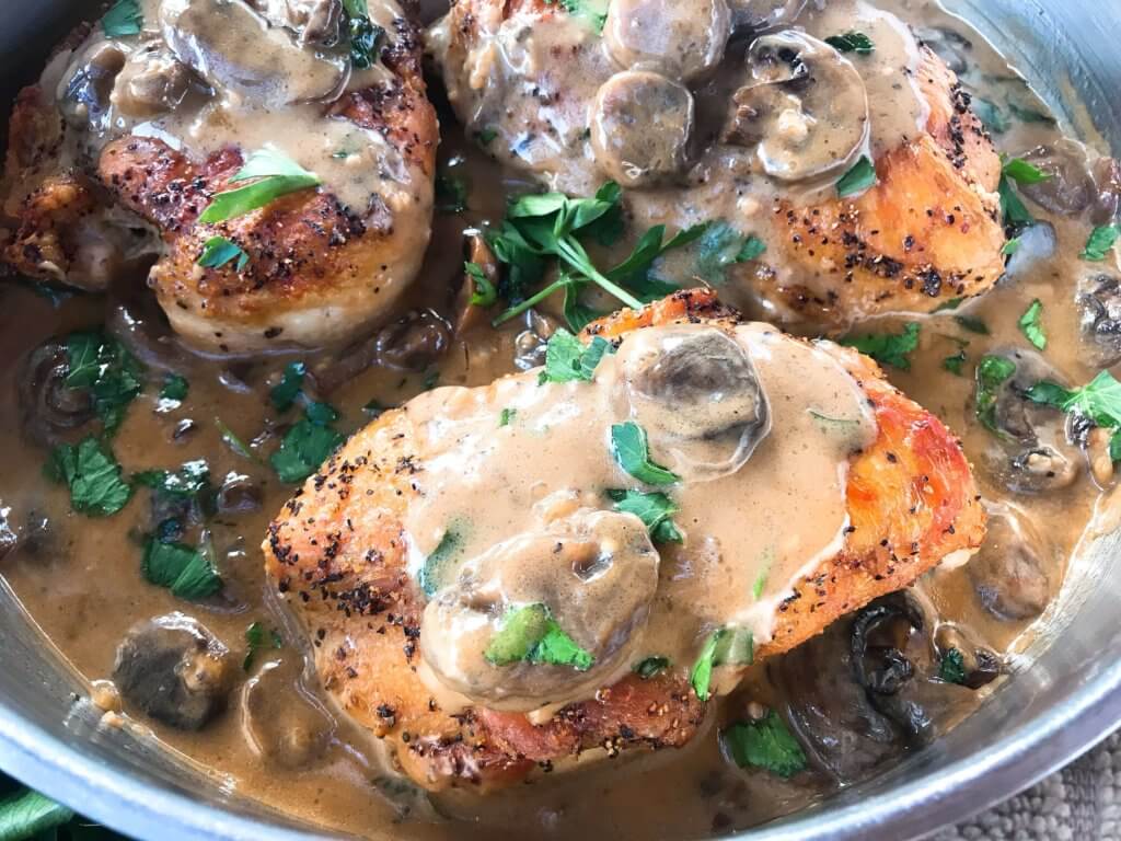 Skillet Chicken Marsala is a one pot meal ready in just 30 minutes. A quick and simple dinner recipe great with potatoes, pasta, rice, and vegetables. Chicken breasts cooked with Marsala wine sauce and mushrooms. Gluten free. #chickenrecipes #chickendinner #chickenmarsala #30minutemeals