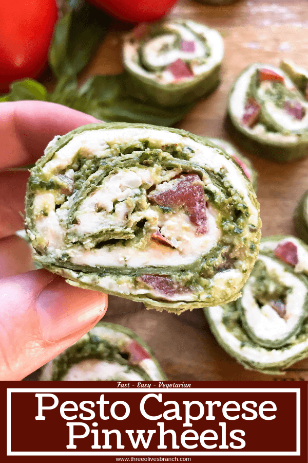 Fast and simple party appetizer recipe. Vegetarian Caprese Pesto Pinwheels Roll Ups are made of cream cheese, mozzarella, Parmesan, basil pesto, and tomatoes rolled in a flour tortilla. Easy finger food for entertaining or game day. #basilpesto #caprese #pinwheels #appetizers 