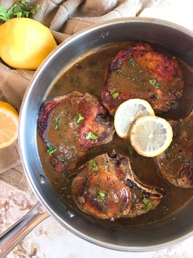 A quick and simple pork dinner recipe ready in 30 minutes. Skillet Pork Chops in Mustard Apple Cider Sauce featuring fall flavors is a one pot dish with lots of flavor. Gluten free meal. #porkchops #30minutemeals #onepotdinner