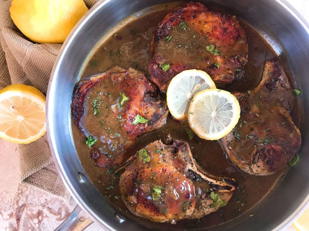 A quick and simple pork dinner recipe ready in 30 minutes. Skillet Pork Chops in Mustard Apple Cider Sauce featuring fall flavors is a one pot dish with lots of flavor. Gluten free meal. #porkchops #30minutemeals #onepotdinner