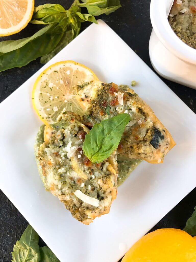 Fresh and bright flavors in a classic Italian dinner recipe. Zucchini Lemon Stuffed Shells with Creamy Pesto Sauce are stuffed with zucchini, lemon, ricotta, and Parmesan cheese. Topped with creamy basil pesto sauce. Vegetarian. #italianrecipes #stuffedshells #zucchinirecipes #pesto