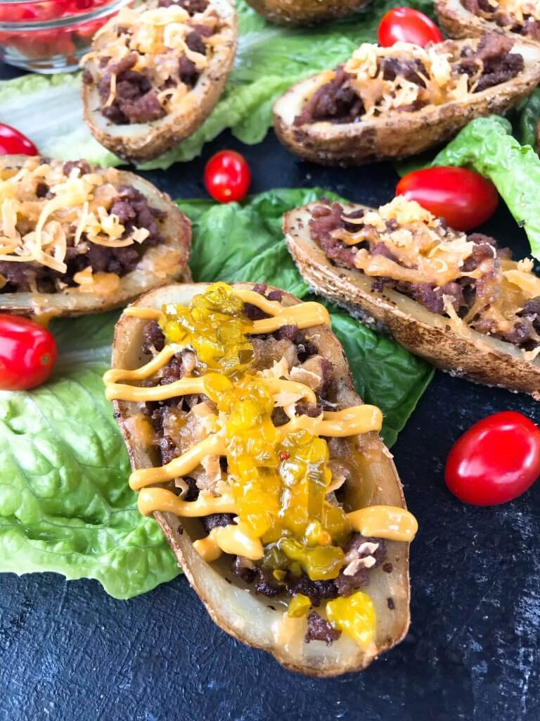 Cheeseburger Potato Skin Bar is a fun game day or party entertaining finger food recipe. Let guests build their own favorite American cheeseburger flavor with all the toppings. Gluten free. #potatoskins #cheeseburger #hamburger