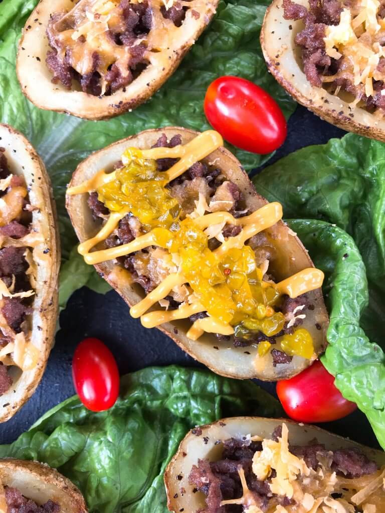 Cheeseburger Potato Skin Bar is a fun game day or party entertaining finger food recipe. Let guests build their own favorite American cheeseburger flavor with all the toppings. Gluten free. #potatoskins #cheeseburger #hamburger