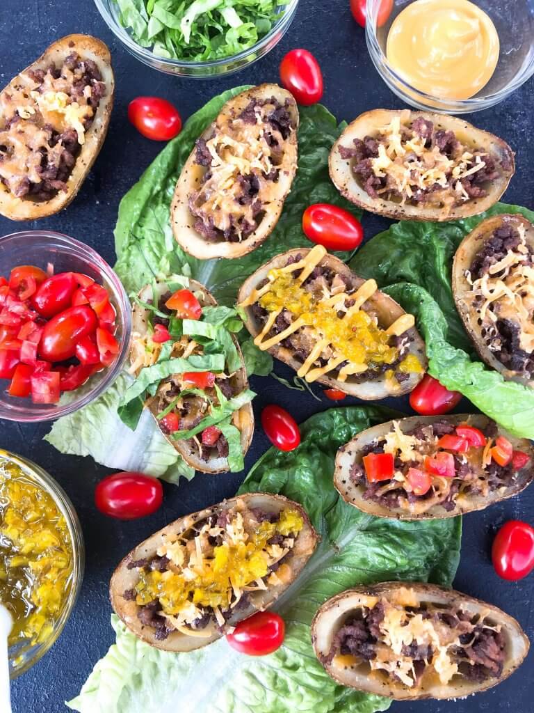 Cheeseburger Potato Skin Bar is a fun game day or party entertaining finger food recipe. Let guests build their own favorite American cheeseburger flavor with all the toppings. Gluten free. #potatoskins #cheeseburger #hamburger