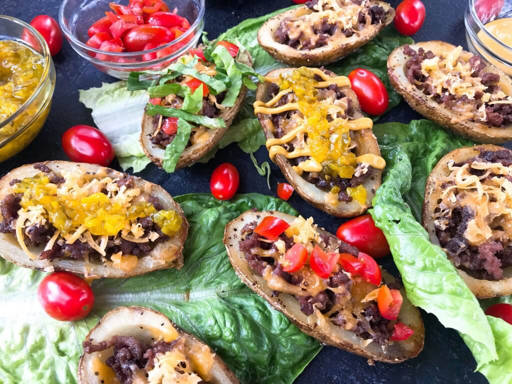 Cheeseburger Potato Skin Bar is a fun game day or party entertaining finger food recipe. Let guests build their own favorite American cheeseburger flavor with all the toppings. Gluten free. #potatoskins #cheeseburger #hamburger