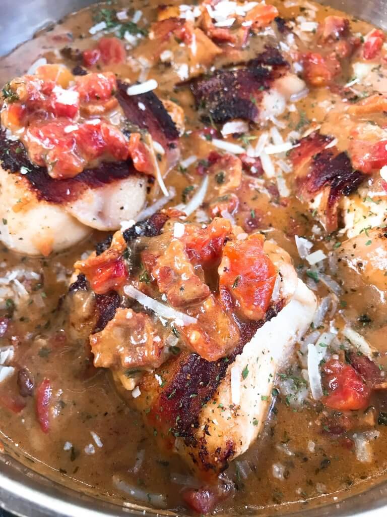 Skillet Bacon Wrapped Chicken in Tomato Bacon Parmesan Sauce is a gluten free one pot easy dinner. Make extra cheese sauce to spoon over vegetables, potatoes, or rice. Quick and simple meal. #chickendinner #baconchicken #onepotrecipe