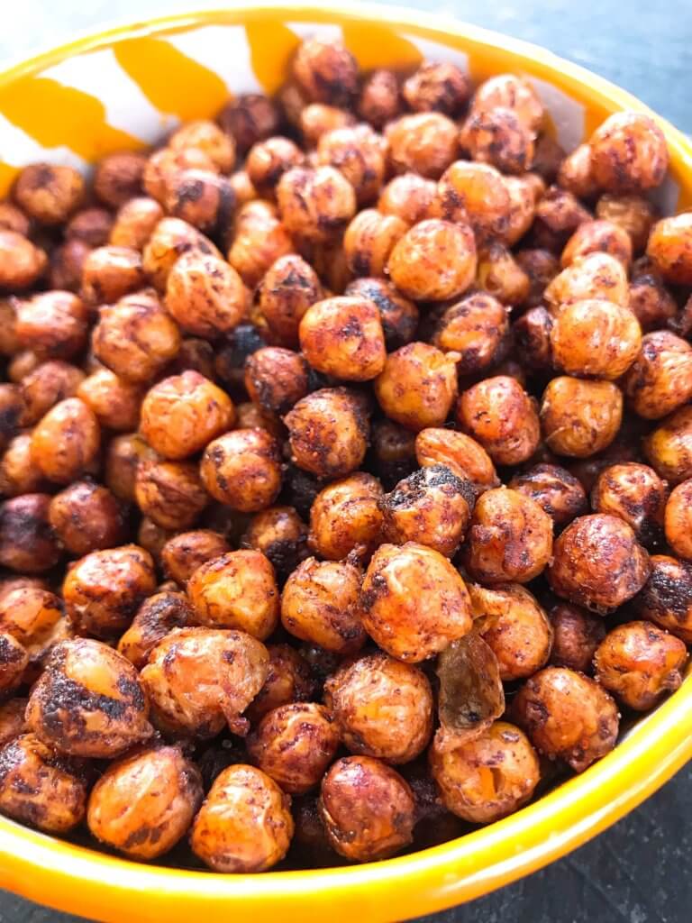 A healthy, vegan, dairy free, gluten free snack or party appetizer recipe. Healthy game day recipe. Simple and easy to make, Spicy Cocoa Espresso Roasted Chickpeas are coated in cayenne pepper, cocoa and coffee. #fingerfood #gamedayrecipes #healthysnacks