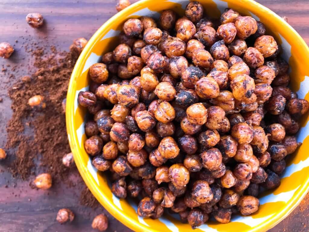 A healthy, vegan, dairy free, gluten free snack or party appetizer recipe. Healthy game day recipe. Simple and easy to make, Spicy Cocoa Espresso Roasted Chickpeas are coated in cayenne pepper, cocoa and coffee. #fingerfood #gamedayrecipes #healthysnacks