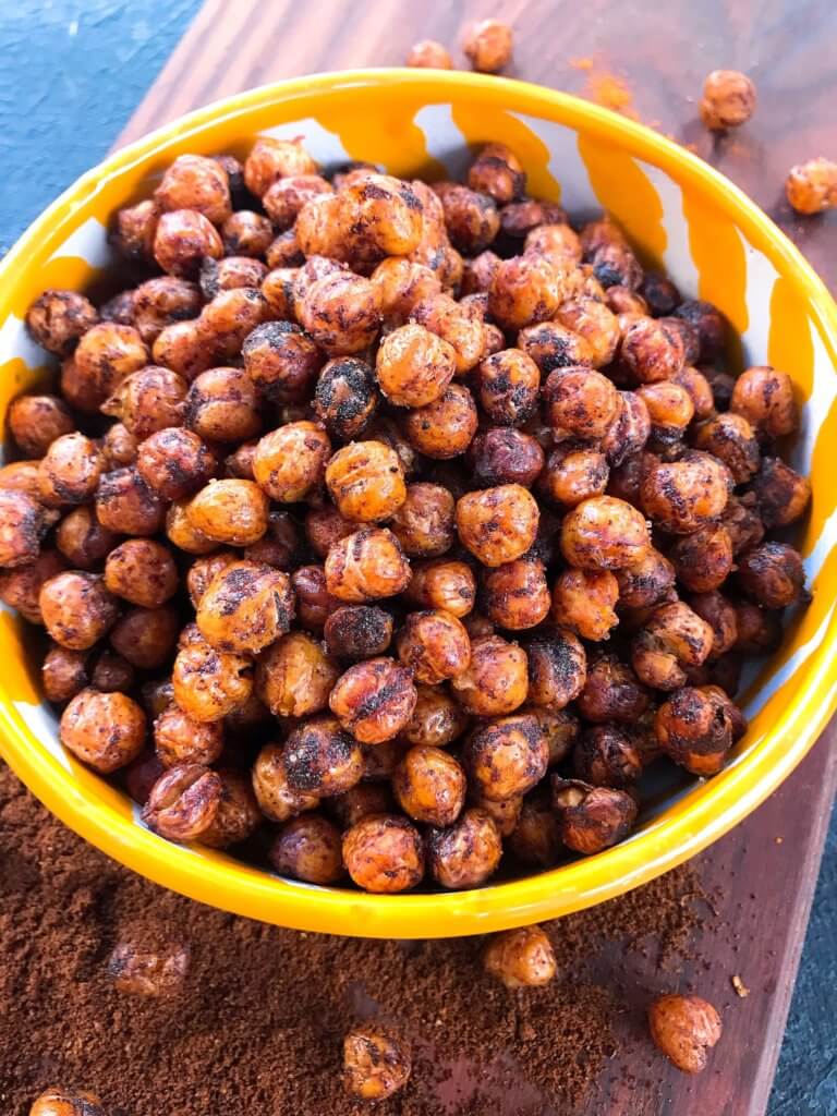 A healthy, vegan, dairy free, gluten free snack or party appetizer recipe. Healthy game day recipe. Simple and easy to make, Spicy Cocoa Espresso Roasted Chickpeas are coated in cayenne pepper, cocoa and coffee. #fingerfood #gamedayrecipes #healthysnacks