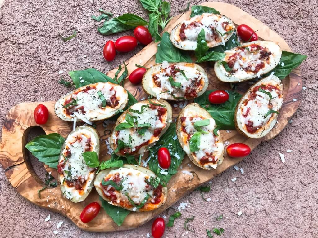 Beef lasagna potato skins recipe with ricotta, Parmesan, and mozzarella cheeses layered with marinara sauce and ground beef in a potato skin shell. Gluten free. #italianrecipe #potatoskins #beeflasagna #glutenfreerecipes