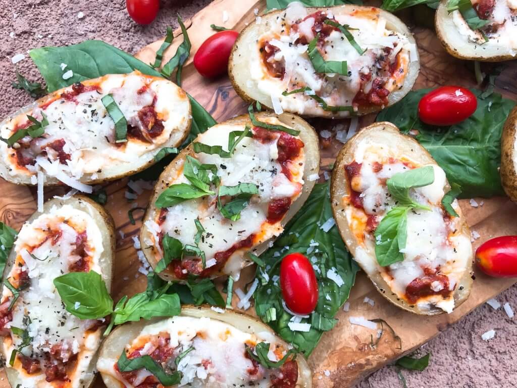 Beef lasagna potato skins recipe with ricotta, Parmesan, and mozzarella cheeses layered with marinara sauce and ground beef in a potato skin shell. Gluten free. #italianrecipe #potatoskins #beeflasagna #glutenfreerecipes