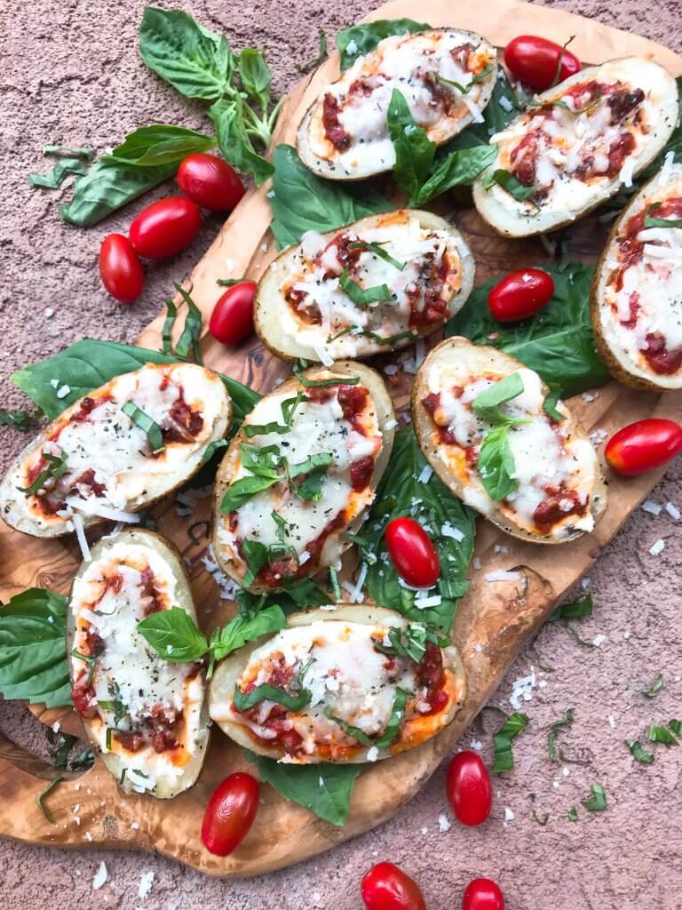 Beef lasagna potato skins recipe with ricotta, Parmesan, and mozzarella cheeses layered with marinara sauce and ground beef in a potato skin shell. Gluten free. #italianrecipe #potatoskins #beeflasagna #glutenfreerecipes