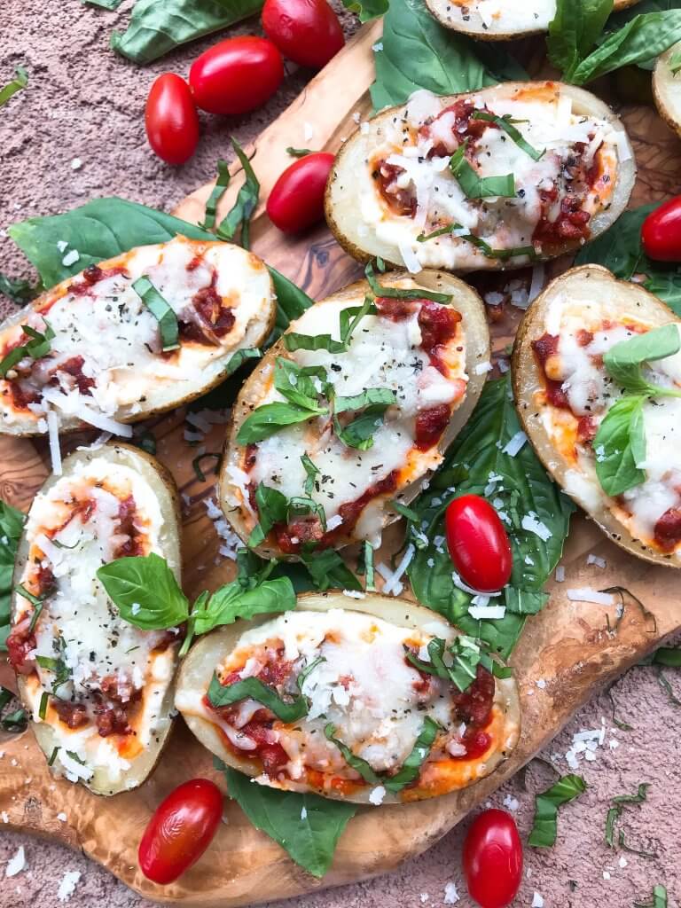 Beef lasagna potato skins recipe with ricotta, Parmesan, and mozzarella cheeses layered with marinara sauce and ground beef in a potato skin shell. Gluten free. #italianrecipe #potatoskins #beeflasagna #glutenfreerecipes