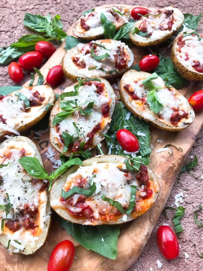 Beef lasagna potato skins recipe with ricotta, Parmesan, and mozzarella cheeses layered with marinara sauce and ground beef in a potato skin shell. Gluten free. #italianrecipe #potatoskins #beeflasagna #glutenfreerecipes