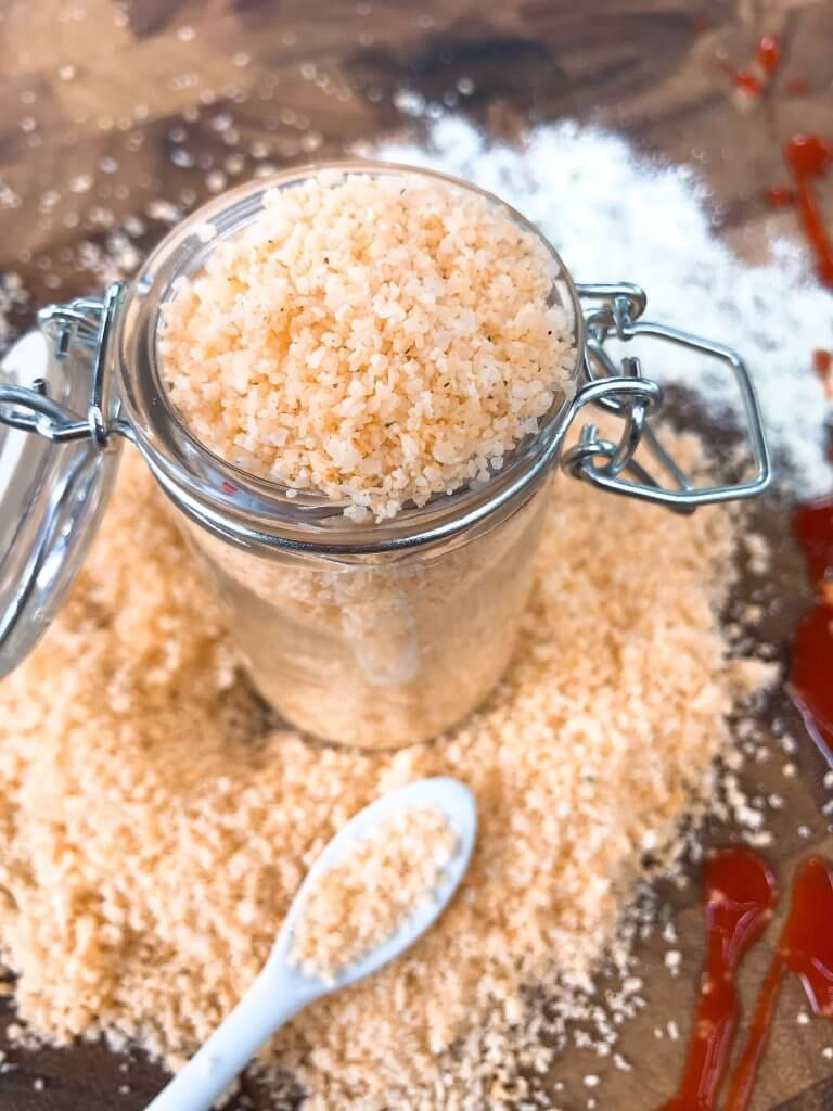 A glass jar filled with buffalo flavored salt