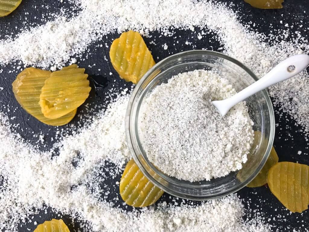 Dill Pickle Flavored Salt is a quick and easy seasoning for grilling and BBQ. Vegan, vegetarian, gluten free, and dairy free recipe. Good on chicken, pork, vegetables, and more. #flavoredsalt #seasoningsalt #pickles