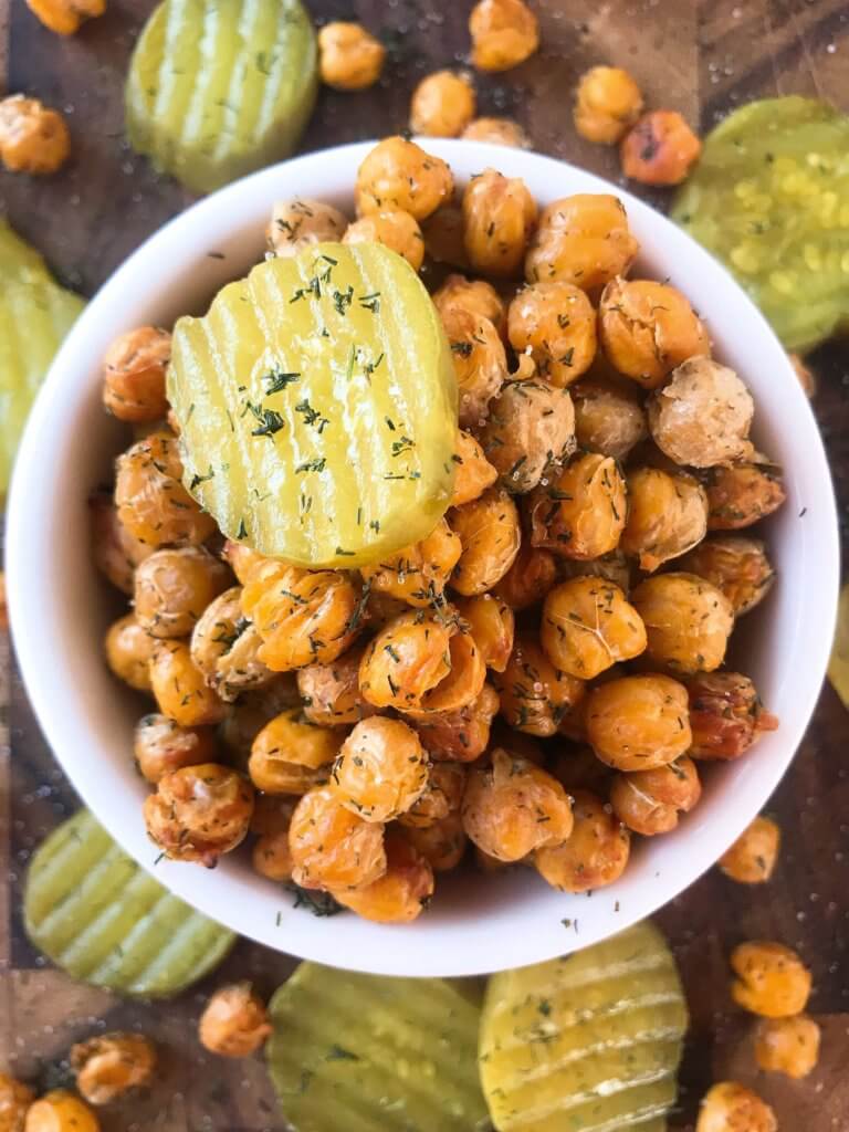 A simple and easy recipe, Dill Pickle Roasted Chickpeas are a healthy appetizer or snack and perfect for game day or entertaining. Vegan, gluten free, and dairy free. Garbanzo beans are roasted with dill and pickle brine. #roastedchickpeas #veganrecipes #gamedayrecipes #healthyappetizers