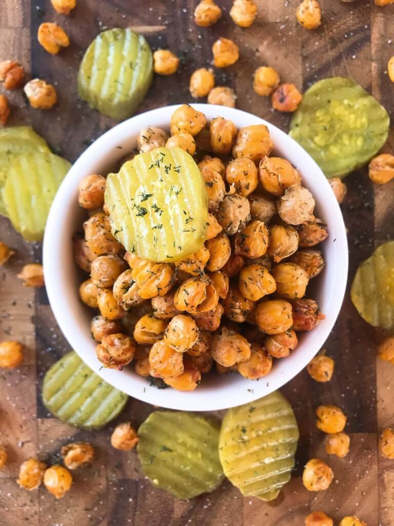 A simple and easy recipe, Dill Pickle Roasted Chickpeas are a healthy appetizer or snack and perfect for game day or entertaining. Vegan, gluten free, and dairy free. Garbanzo beans are roasted with dill and pickle brine. #roastedchickpeas #veganrecipes #gamedayrecipes #healthyappetizers