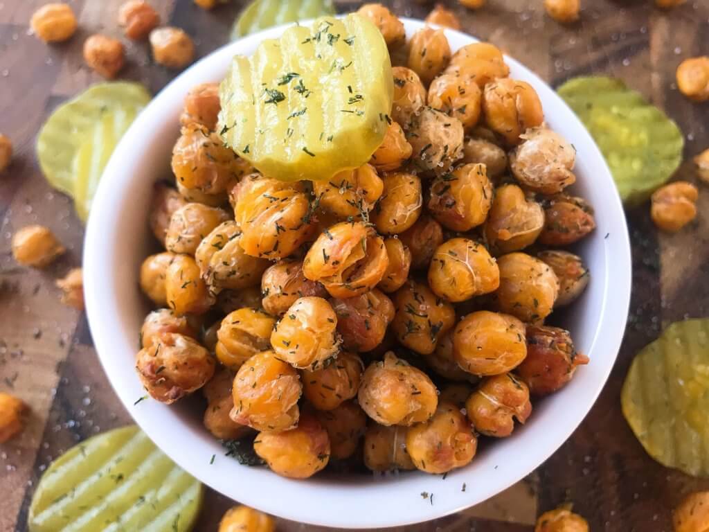 A simple and easy recipe, Dill Pickle Roasted Chickpeas are a healthy appetizer or snack and perfect for game day or entertaining. Vegan, gluten free, and dairy free. Garbanzo beans are roasted with dill and pickle brine. #roastedchickpeas #veganrecipes #gamedayrecipes #healthyappetizers