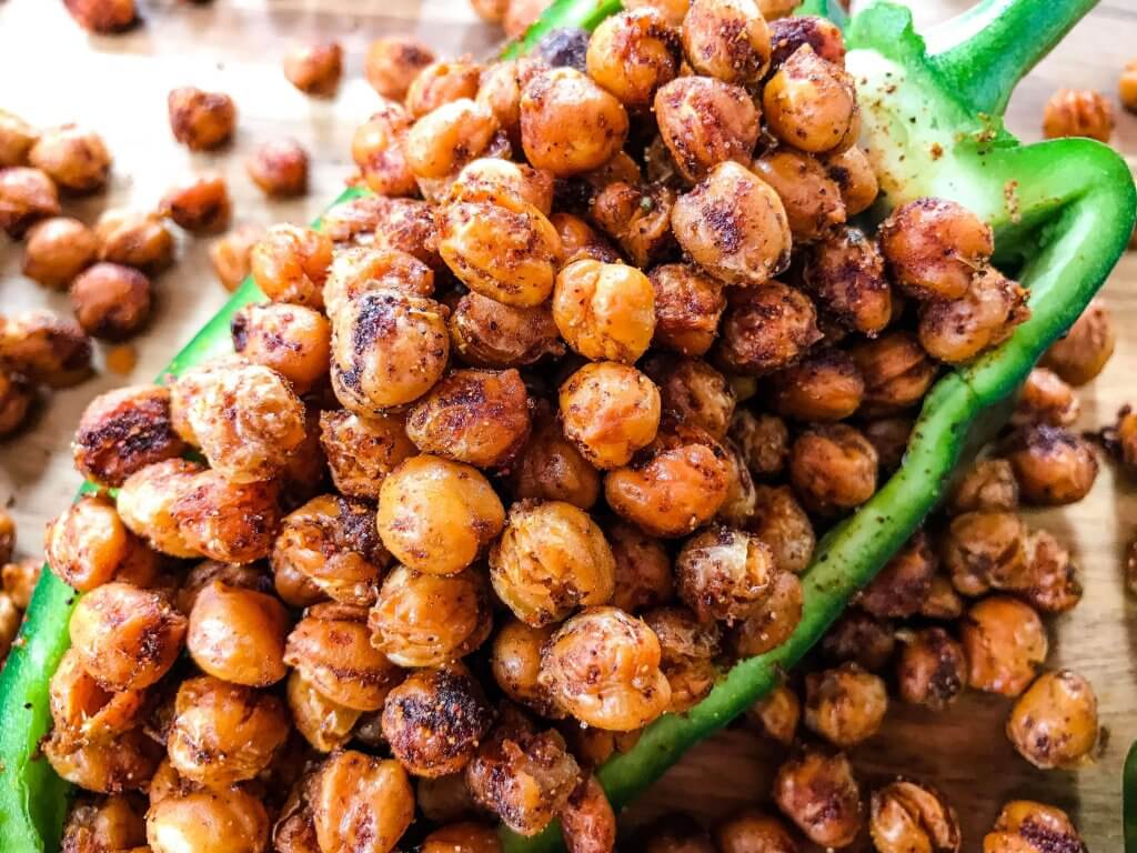 Taco Roasted Chickpeas are a healthy and simple snack recipe! Great for game day and entertaining appetizer, garbanzo beans are roasted and tossed with Mexican spices of chili powder, cumin, and cayenne. Vegan, vegetarian, gluten free, dairy free. #roastedchickpeas #healthysnack